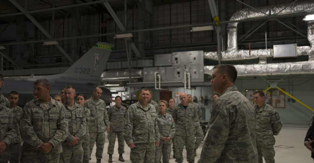 U S Air Force Brig Gen Michael R Taheri commander of the Air National Guard Readiness Center Joint Base Andrews Md speaks to Airmen of the 158th Fighter Wing South Burlington Vt July 31 2015 His visit involved mentoring Airmen to prepare for the Vermont Air National Guard s future U S Air National Guard photo by Airman 1st Class Jeffrey Tatro Unit 158th Fighter Wing