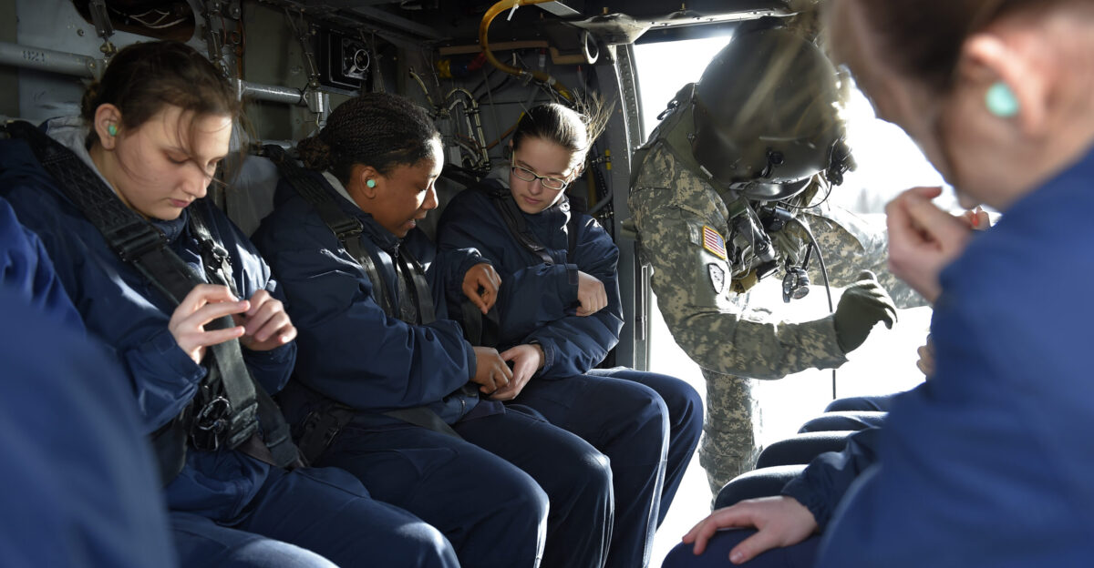 Alaska Military Youth Academy cadets secure themselves in an Alaska Army National Guard UH-60 Black Hawk helicopter assigned to 1st Battalion 507th Aviation Regiment on Joint Base Elmendorf-Richardson Alaska Feb 24 2015 The Alaska Army National Guard participated in the AMYA outreach program to expose the cadets to military life U S Air Force photo Alejandro Pena