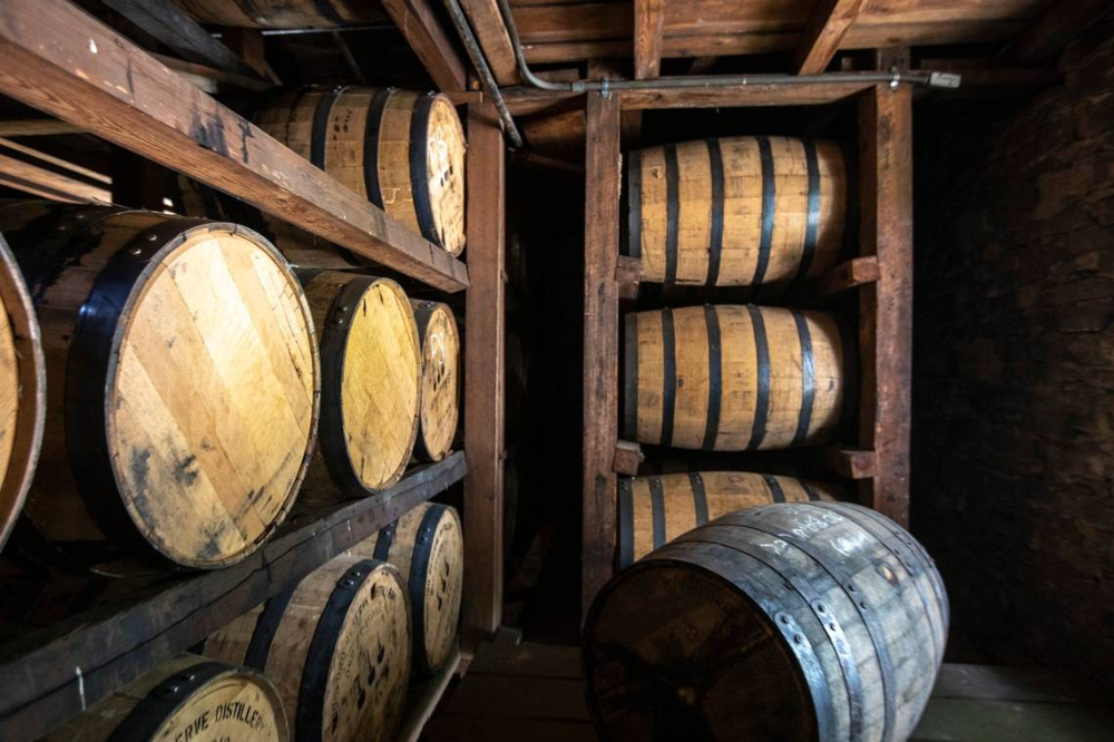 What is the number of barrels of bourbon aging in Kentucky whiskey warehouses made filled by distillers and what is the value it is taxed at by Barb Thompson