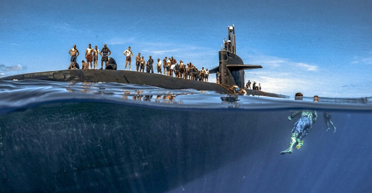 Sailors assigned to Los Angeles-class fast-attack submarine USS Olympia participate in a swim call at sea in the Pacific Ocean July 31 2018 by Charlie Bravo