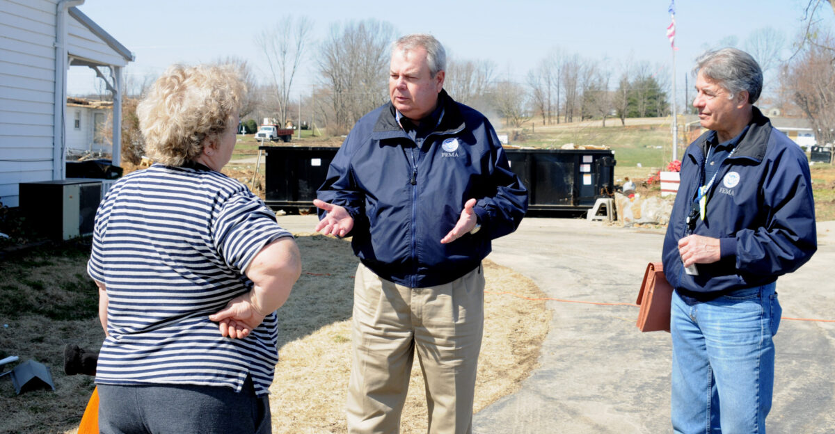 Greenville KY March 12 2008 - FEMA Assistant External Affairs Officer for Community Relations CR Roger Ingram left presents information about how FEMA can help this homeowner as CR Specialist Larry Rankin looks on Numerous homes were damaged in Hopkins County by severe storm and tornado in February and a Federal Disaster Declaration brings FEMA here to help George Armstrong FEMA