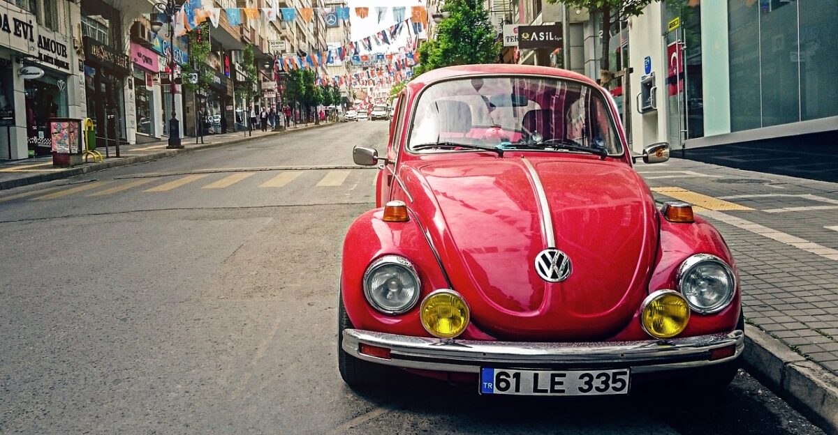 automotive volkswagen beetle car city classic classic car old car car wallpapers pavement red car parked car road sidewalk street vehicle city street vintage volkswagen vw beetle