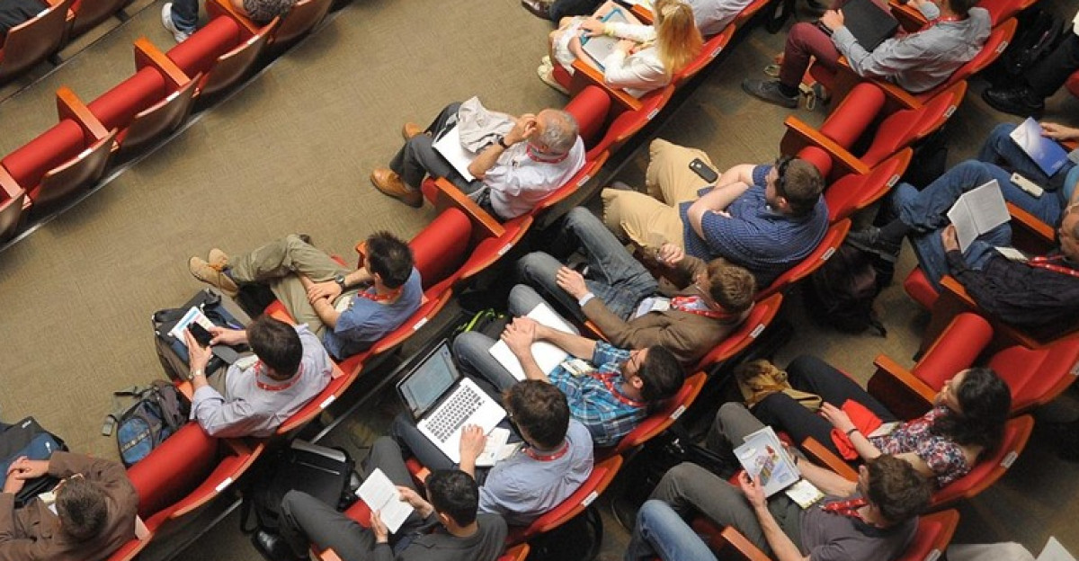 event venue auditorium meeting international conference forum conference listener audience public people sit watching meeting meeting conference conference conference conference conference audience