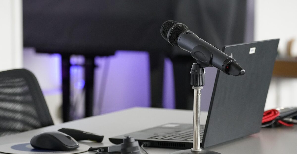 laptop conference table mouse work business online remote microphone podcast podcast podcast podcast podcast podcast