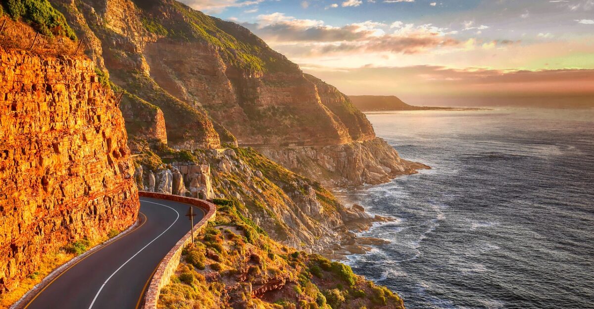 road coast cliff sunset mountains south atlantic landscape sea ocean vacations water summer tourism sky south cape rock clouds twilight evening nature south africa