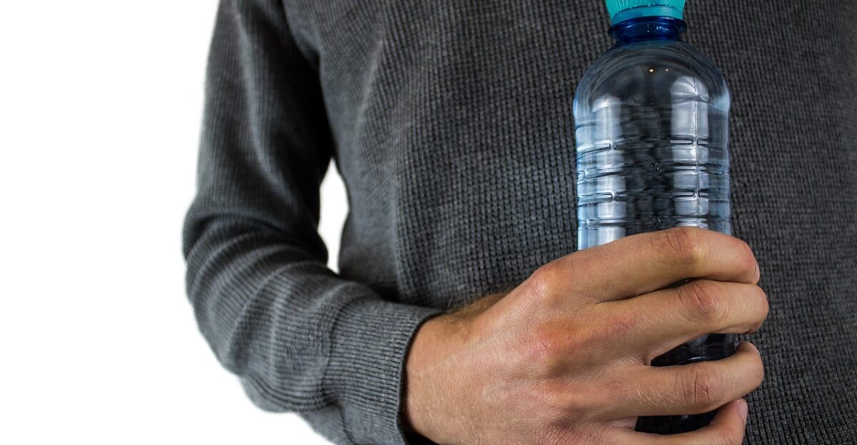 water bottle plastic bottle drinking bottle water nature mineral water pet bpa plastic bottles man hand