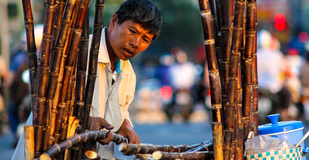 street sugarcane vendor people outside food drink sugarcane sugarcane sugarcane sugarcane sugarcane
