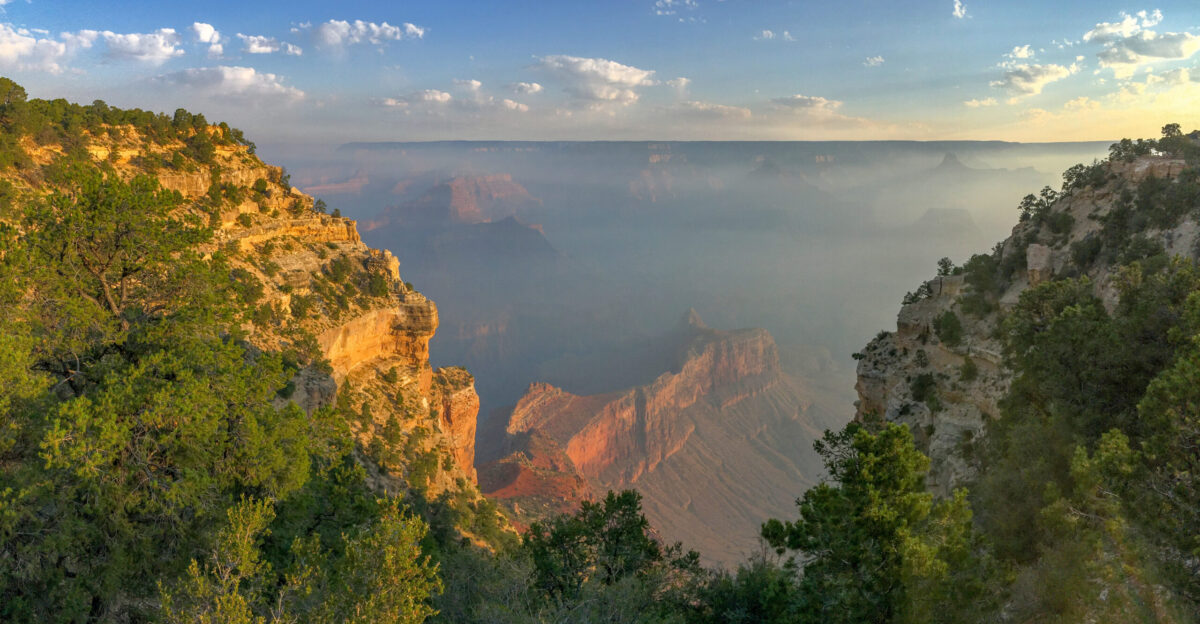 Smoke within Grand Canyon as seen between canyon walls at sunrise on Thursday August 15 2019 The view near Powell Point on the South Rim Heat Warnings are in effect today and tomorrow The high temperature on the canyon rim is expected to be 90 F and inside the canyon 113 F Management fires burning nearby may continue to produce visible smoke on both North South Rims Smoke settled into Grand Canyon overnight but may lift as temperatures warm throughout the day With the heat and smoke it would be best to limit outdoor activities today and tomorrow NPS M Quinn 20190815