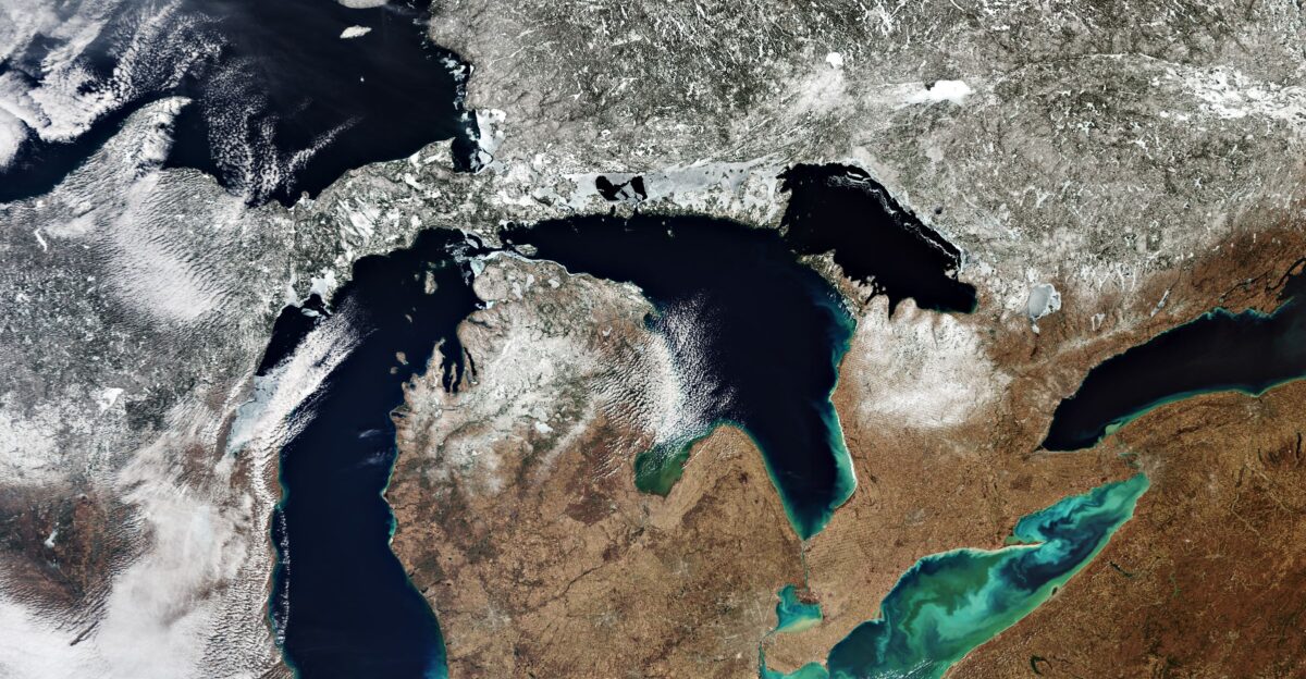 All five of North America s Great Lakes are pictured in this spectacular image captured by the Copernicus Sentinel-3 mission Lake Superior Michigan Huron Erie and Ontario The Great Lakes are a chain of deep freshwater lakes With a combined area of around 244 000 sq km the lakes represent the largest surface of freshwater in the world - covering an area exceeding that of the United Kingdom Around 100 000 years ago a major ice sheet formed over most of Canada and part of the US As it formed giant glaciers flowed into the land carving out valleys and levelling mountains As higher temperatures began to melt the ice sheet meltwater filled the holes left by the glaciers Many of these holes today still contain water and formed the thousands of lakes across central USA and Canada The biggest remnants of this process are the Great Lakes The lakes drain roughly from west to east and empty into the Atlantic Ocean Lake Superior the northernmost and westernmost lake is the largest and deepest of the Great Lakes It drains into Lake Huron via the St Marys River at an average rate of 2000 cubic metres per second Lake Michigan lies south of Lake Superior and connects with Lake Huron through the six km-wide channel Straits of Mackinac in the north Lake Huron is the second largest of the Great Lakes and is bounded by Michigan US on the north and by Ontario Canada to the east Lake Erie is the shallowest and southernmost of the Great Lakes Green algal blooms are visible on the lake These toxic blooms have been a problem for the lake in recent years Caused by heightened levels of phosphorus - found in fertilisers and common household products - finding its way into the water these blooms have caused harm to the lake s fish population Lake Ontario is the easternmost of the Great Lakes and also the smallest in surface area It is bounded on the north by Ontario Canada and on the south by New York US whose water boundaries meet in the middle of the lake In this image captured on 15 March 2020 a large quantity of ice and snow coverage is visible north of the lakes yet the amount of ice cover on the lakes is minimal - extremely unusual for the ice season which typically runs from 1 December through 30 April Parts of the Great Lakes typically freeze every winter As Earth s climate changes rising air and water temperatures have led to less ice cover on many lakes in North America including the Great Lakes Ice cover on the Great Lakes can fluctuate dramatically from year to year depending on several patterns of climate variability Years with lower-than-normal ice cover appear to have become more frequent during the past two decades Sentinel-3 is a two-satellite mission to supply the coverage and data delivery needed for Europe s Copernicus environmental monitoring programme Each satellite s instrument package includes an optical sensor to monitor changes in the colour of Earth s surfaces It can be used for example to monitor ocean biology and water quality This image is also featured on the Earth from Space video programme