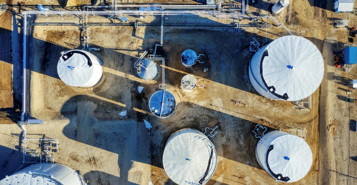 Top-down drone photograph of industrial silos and pipes in Eyota Minnesota