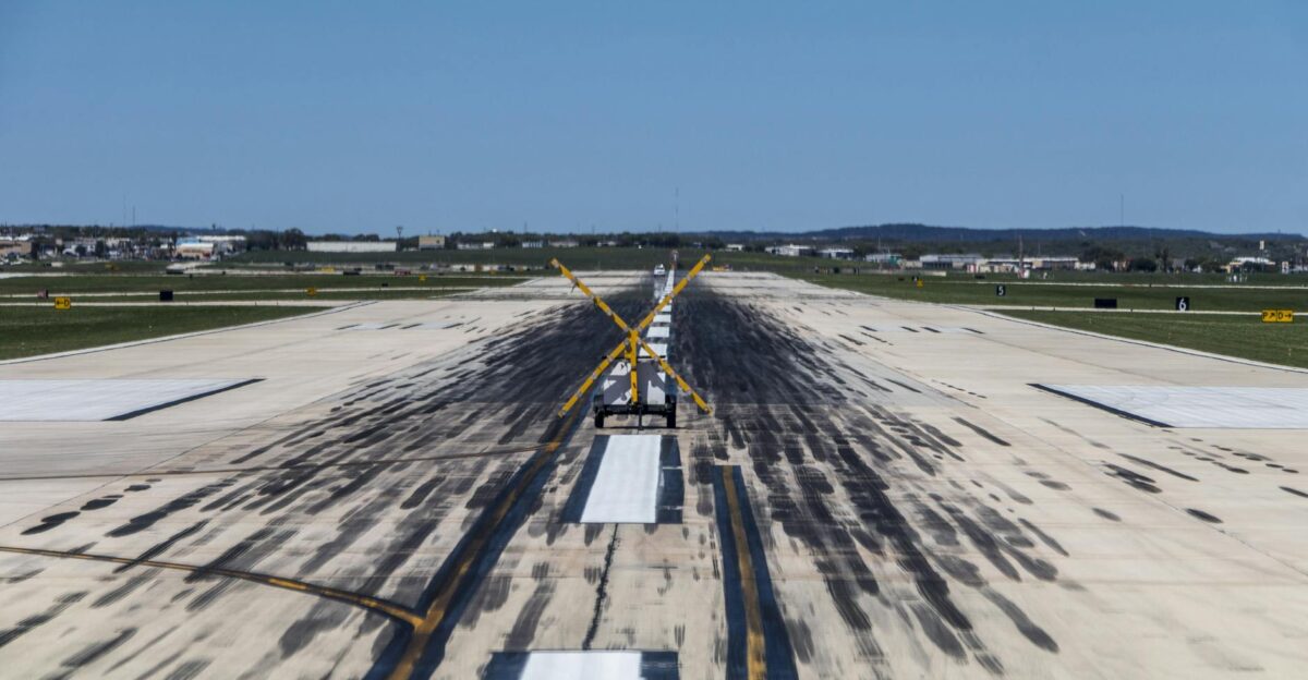 View of a closed runway at San Antonio International Airport under clear skies