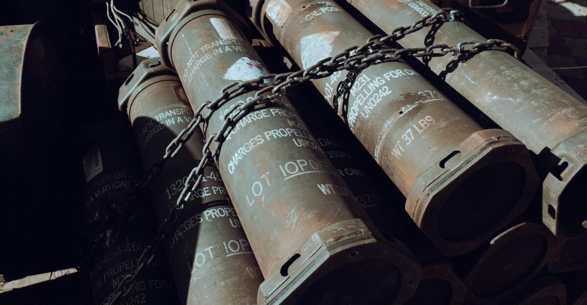 Close-up of chained military missile containers in a warehouse
