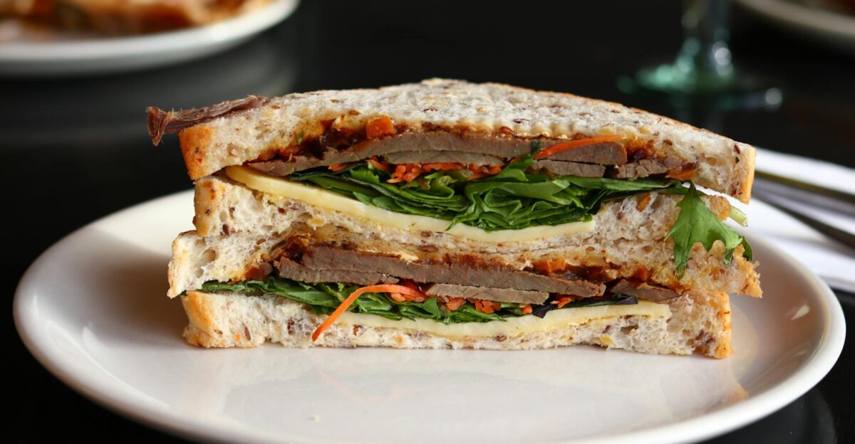 Close-up of a hearty sandwich with fresh ingredients ready to enjoy