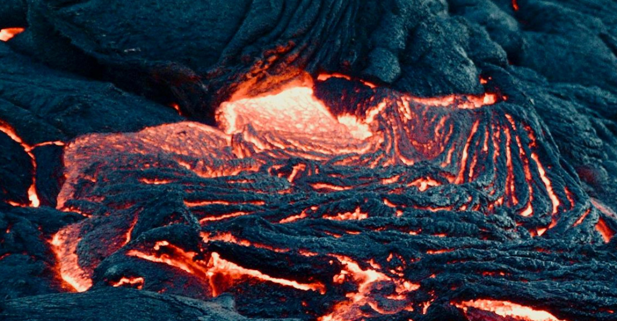 A mesmerizing view of flowing lava on a volcanic landscape capturing the intense heat and texture