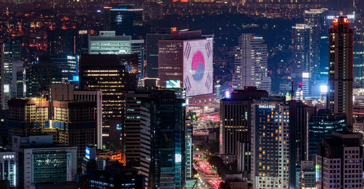 Vibrant night skyline of Seoul featuring illuminated skyscrapers and urban landscape
