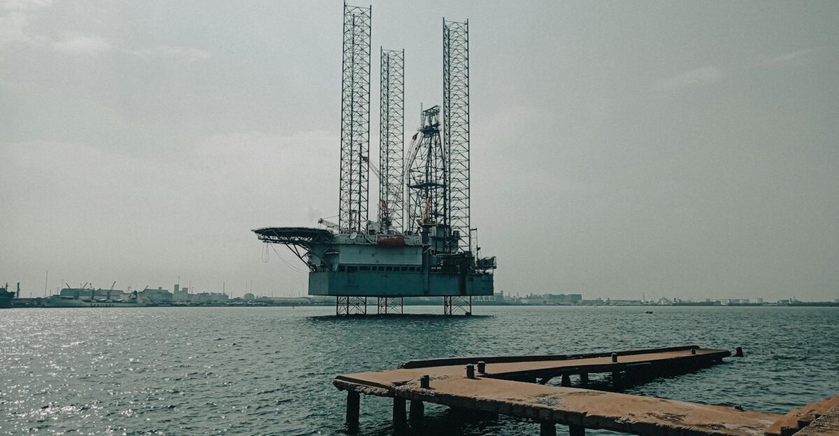 Offshore oil platform in urban harbor showcasing industrial scenery and oceanic platform structure