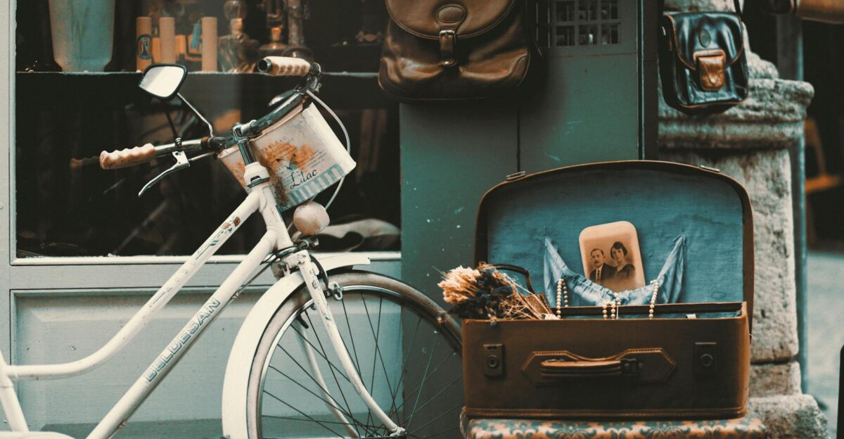 Retro-themed outdoor scene with vintage bicycle suitcase and nostalgic elements