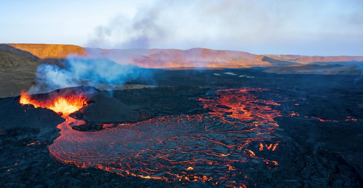 A breathtaking aerial shot of a volcanic eruption with flowing lava in Grindavik Iceland