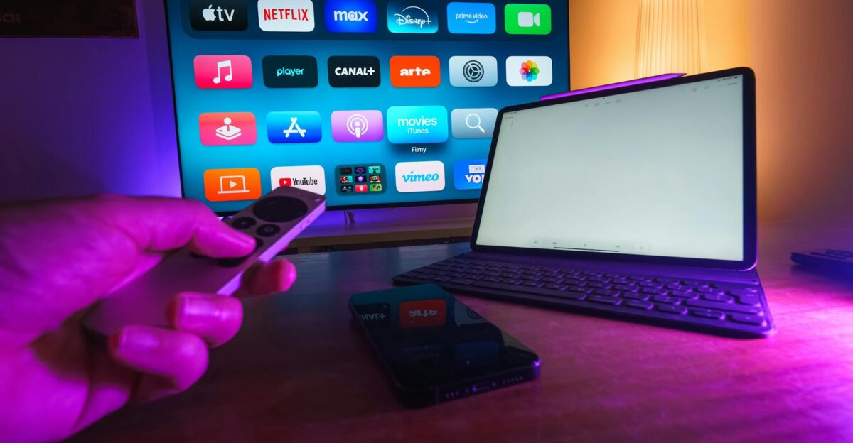 A cozy home setup featuring streaming services on smart TV tablet and smartphone