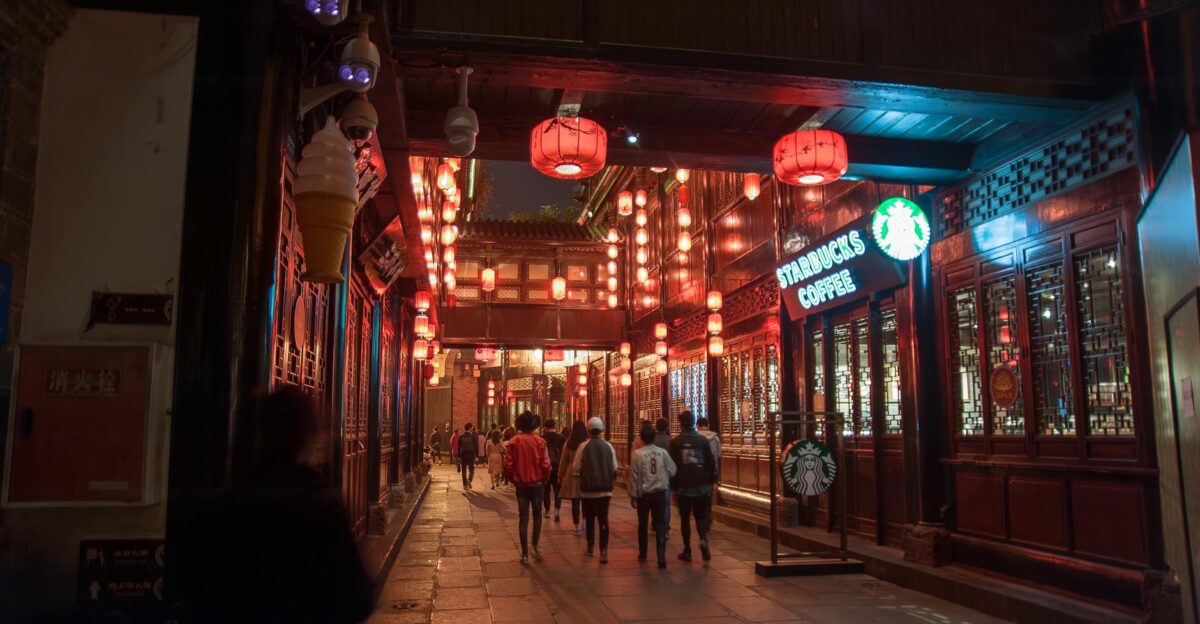 Vibrant night scene on a lively street in Chengdu China with red lanterns and people strolling