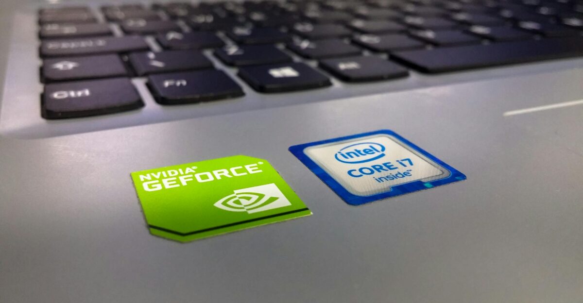 Detailed close-up of a laptop keyboard featuring Intel Core i7 and NVIDIA GeForce stickers highlighting technology components