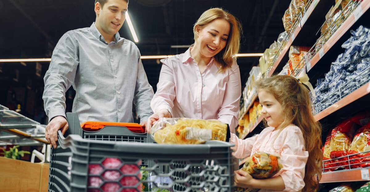 A joyful family of three shopping together in a supermarket creating a memorable experience