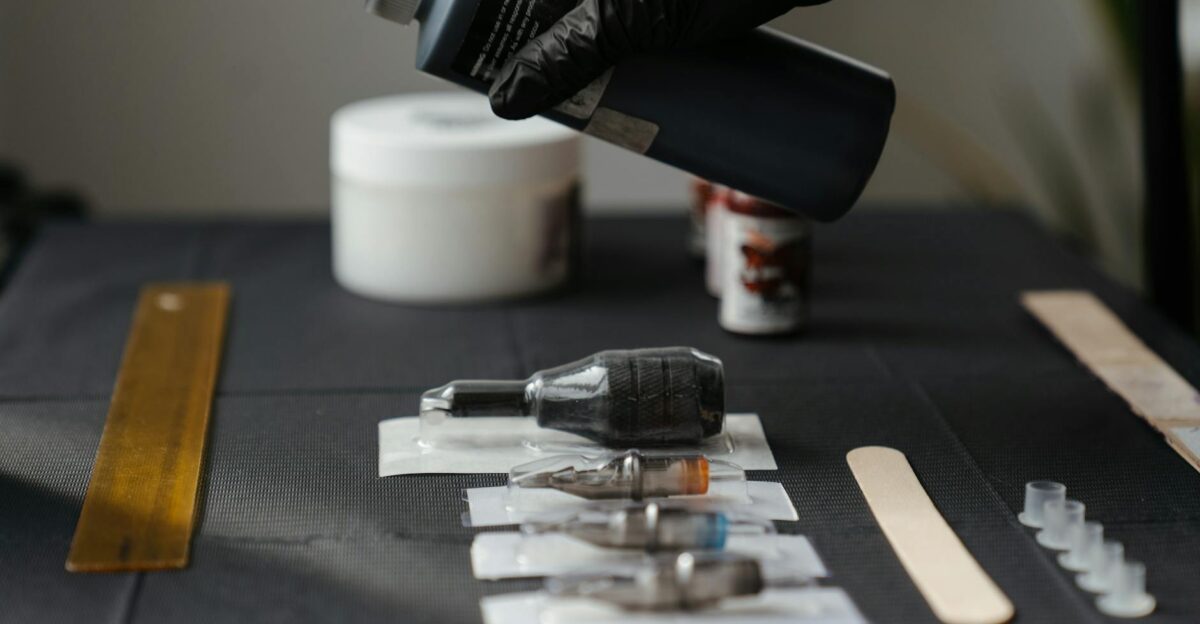 Close-up of tattoo equipment and ink in a tattoo studio showcasing tools and preparation