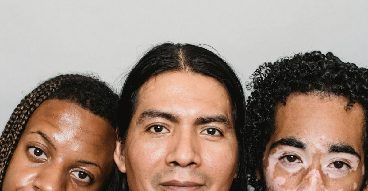 Portrait of three diverse men embodying acceptance and body positivity in a studio setting