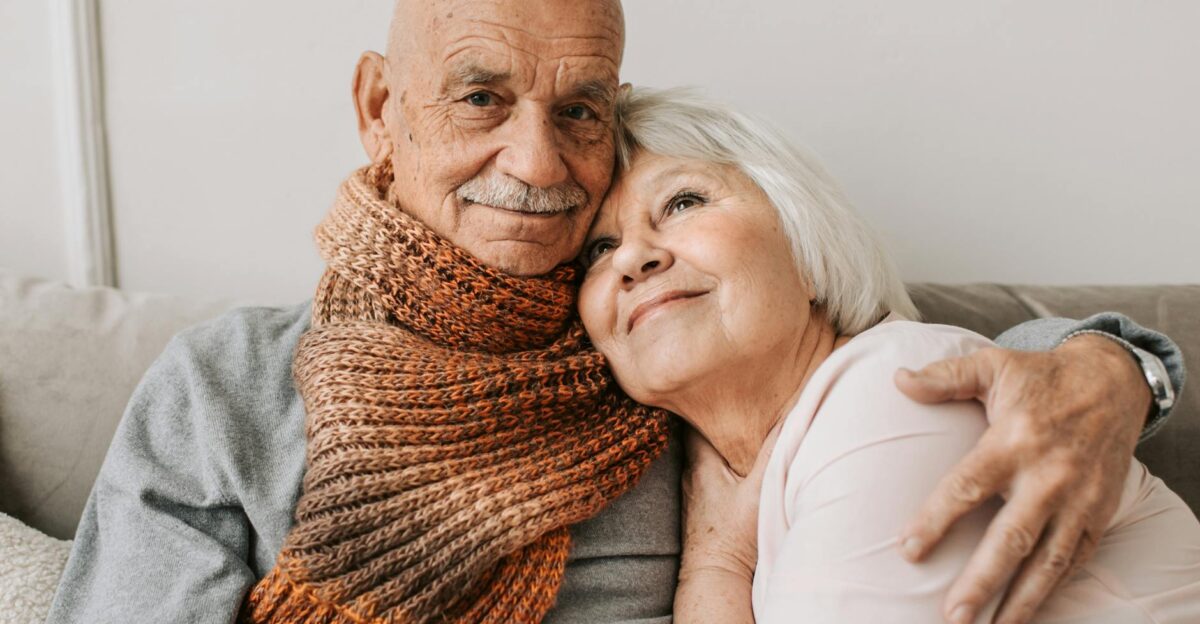 Elderly couple sharing a warm embrace showcasing love and affection