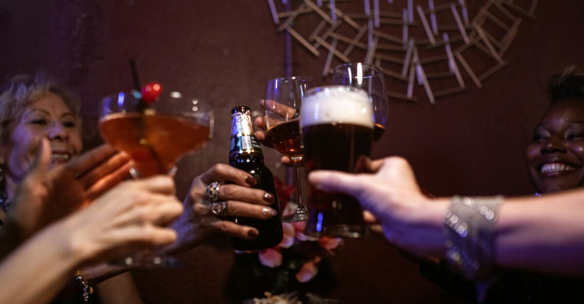 A group of friends cheering with drinks in a lively bar setting capturing the essence of nightlife fun
