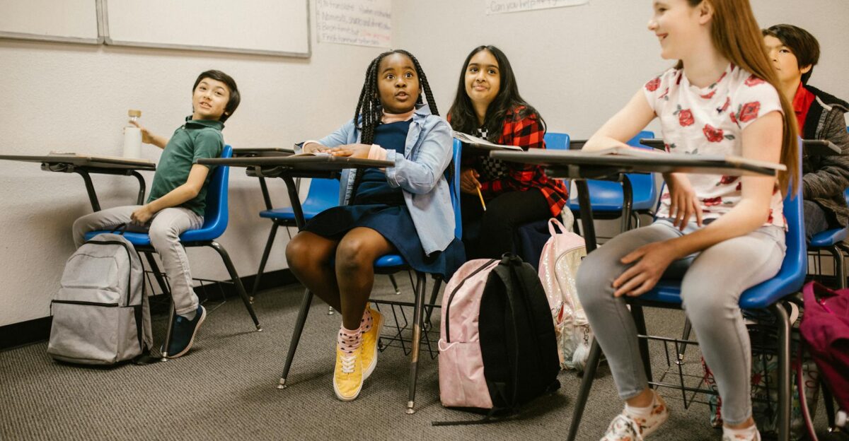 A diverse group of students attentively participating in a classroom setting