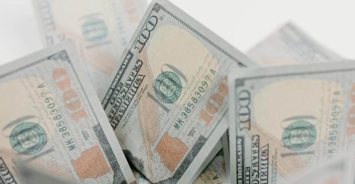 Close-up of US hundred dollar bills ideal for finance or economic concepts