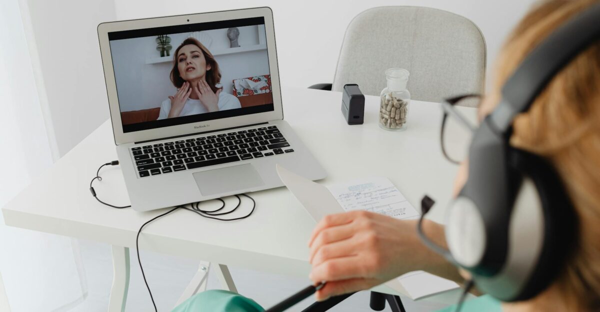 A healthcare professional video conferencing with a patient for an online consultation