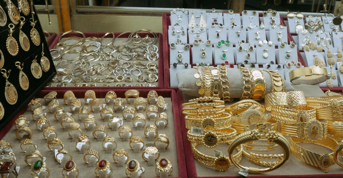 Showcase of elegant gold and silver jewelry in an Istanbul market s display case