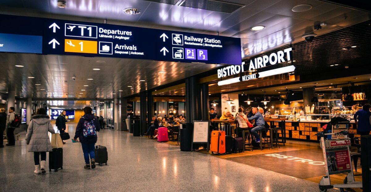 Travelers at Helsinki Airport dining and shopping near departures and arrivals