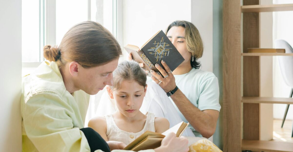 A diverse family bonding through reading together with natural light indoors