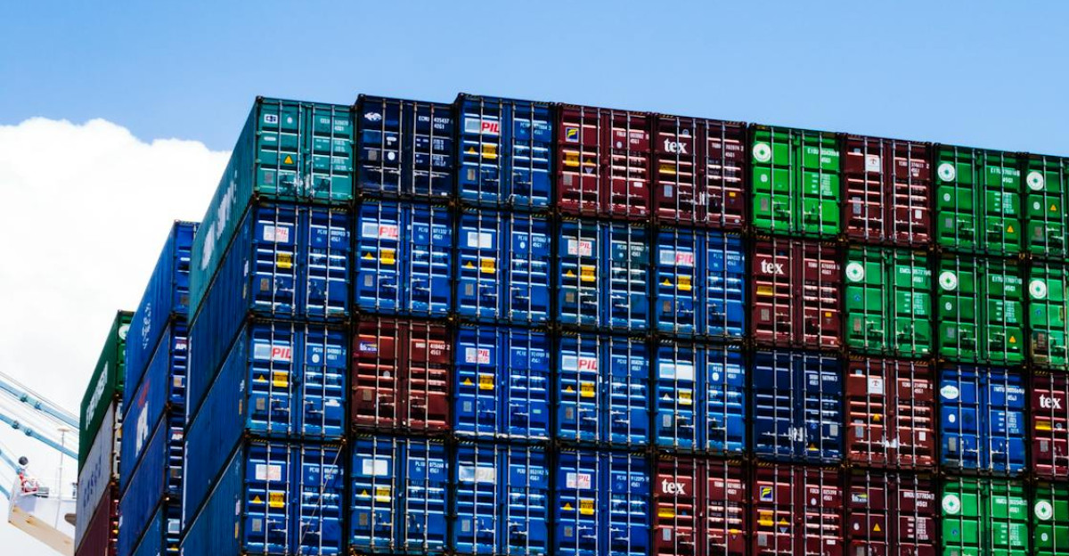 Stacked cargo containers on a massive ship at the harbor symbolizing global trade