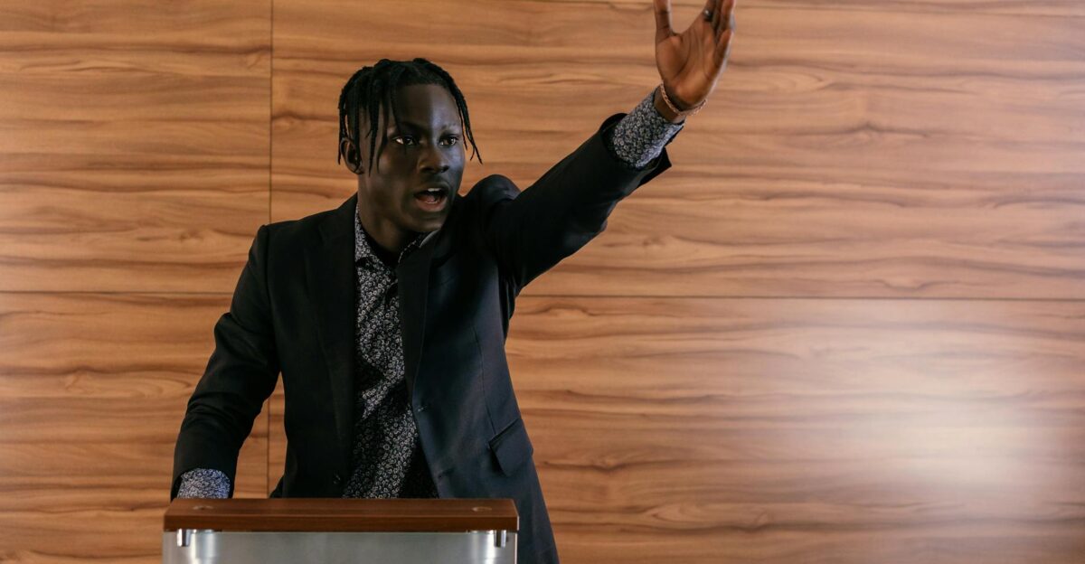 A passionate politician delivering a speech at a podium indoors