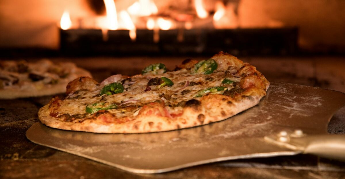 Appetizing gourmet pizza cooked in a wood-fired oven showcasing artisanal toppings