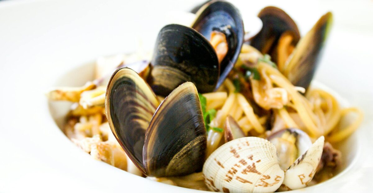 Close-up of Italian seafood pasta with clams and mussels served in Florence