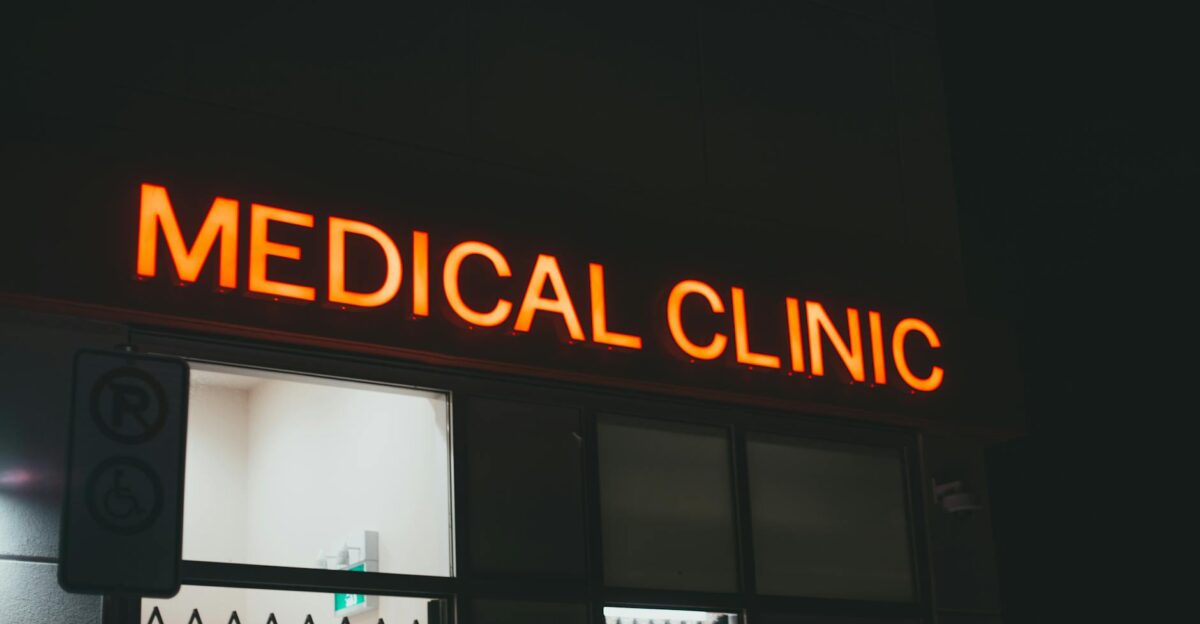 Bright neon medical clinic signage at night creating a vivid street scene