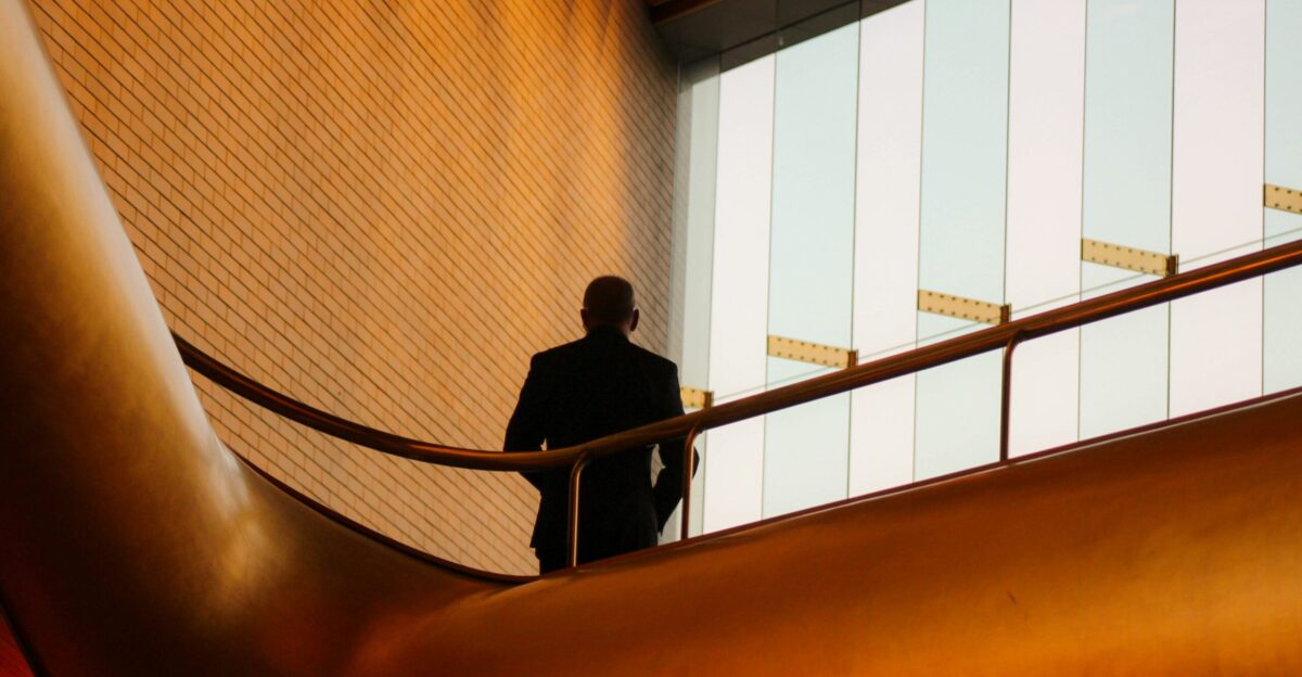 man standing on grill