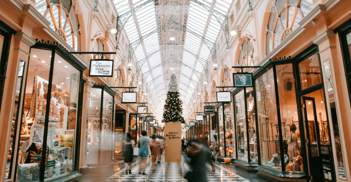 person walking inside building near glass