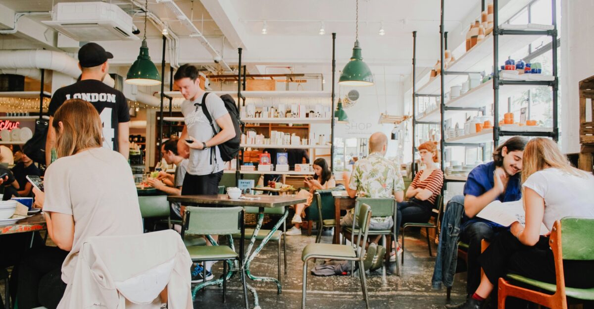people eating inside of cafeteria during daytime