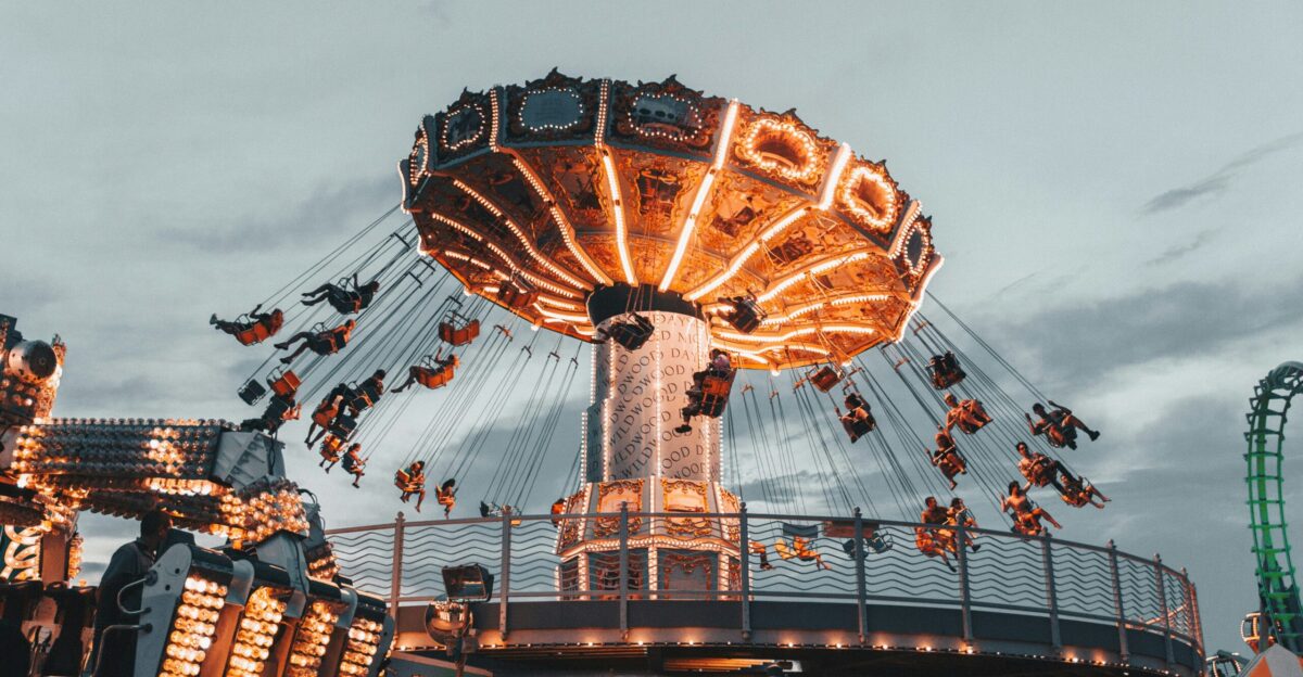 people riding amusement park ride