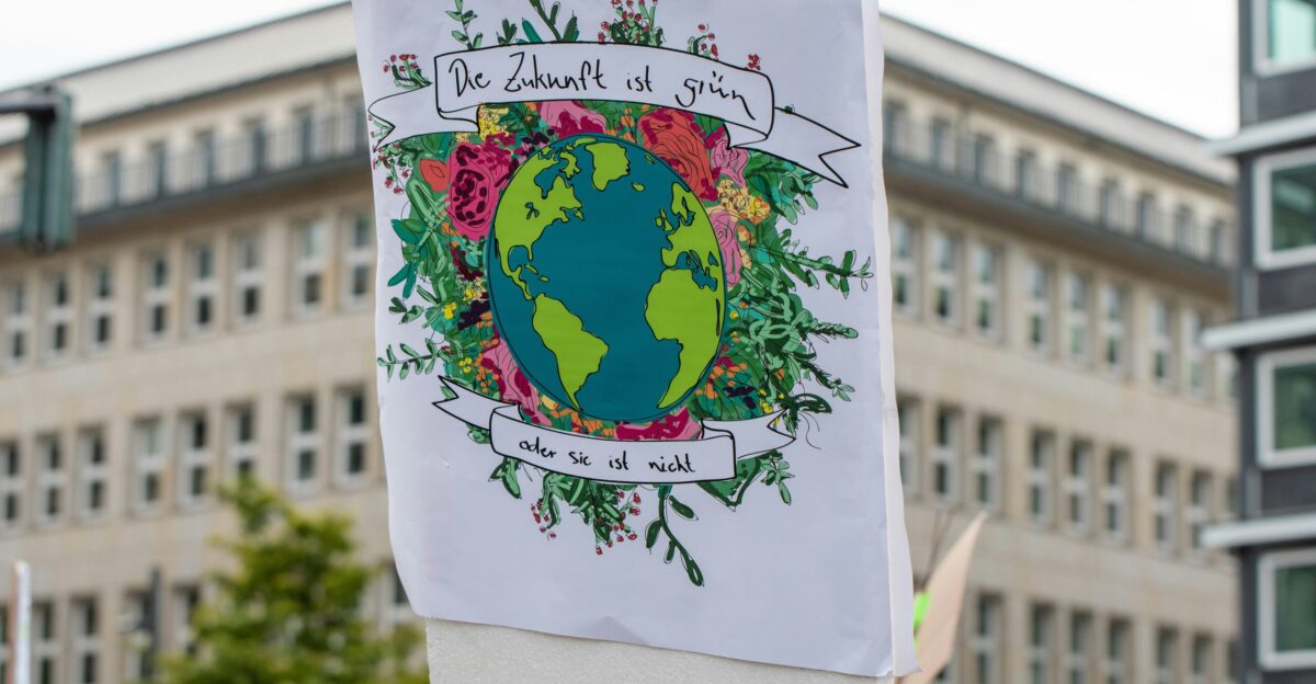 planet earth with flowers sign