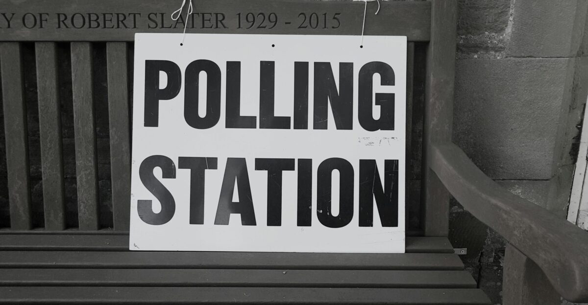 bench with polling station sign