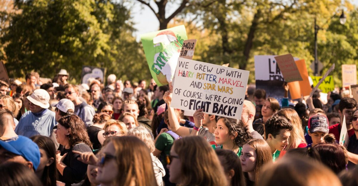crowd holding banners