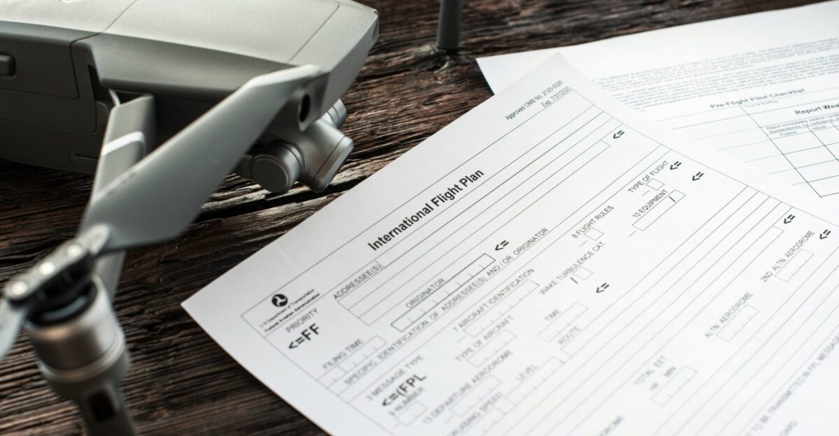 white printer paper on brown wooden table