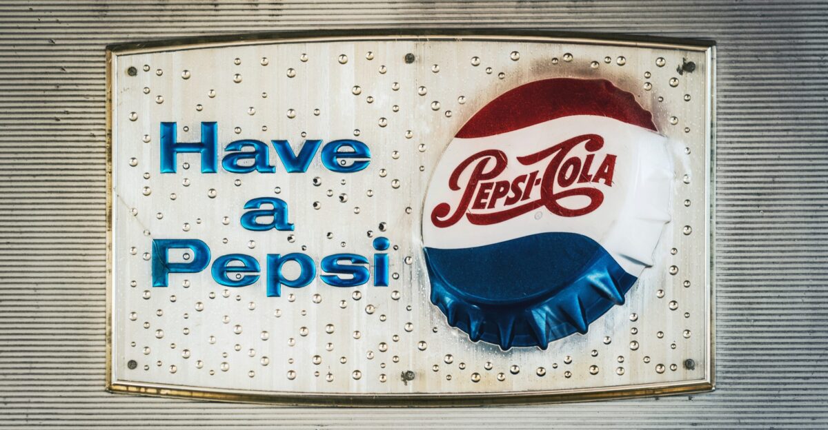pepsi cola can be seen through blue plastic bag
